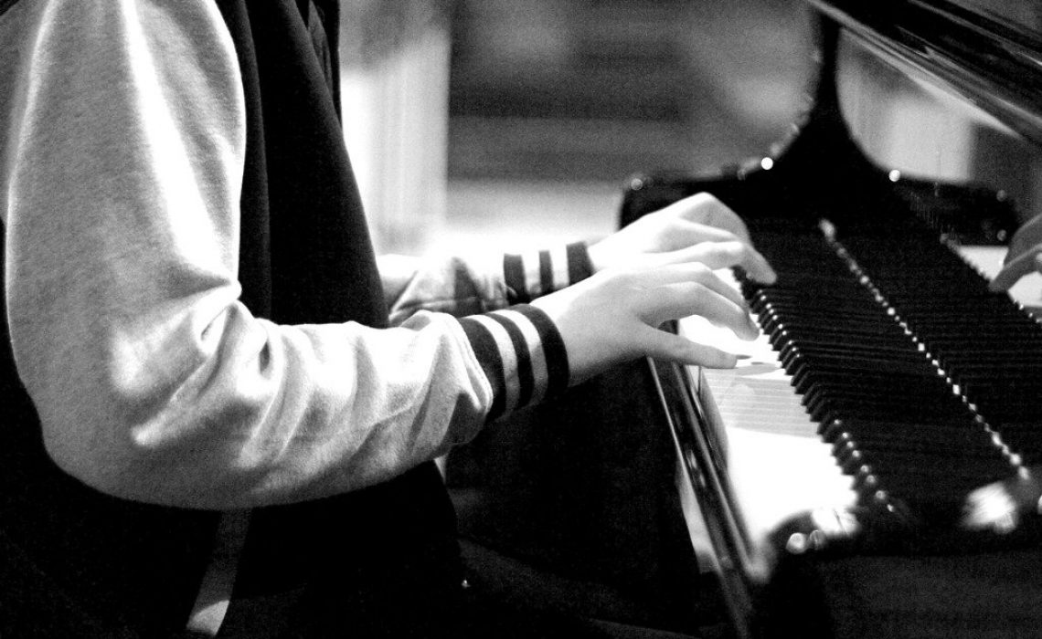 boy-playing-piano-picture-id1144820426